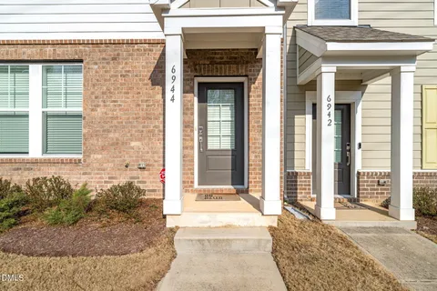 a front view of a house with a porch