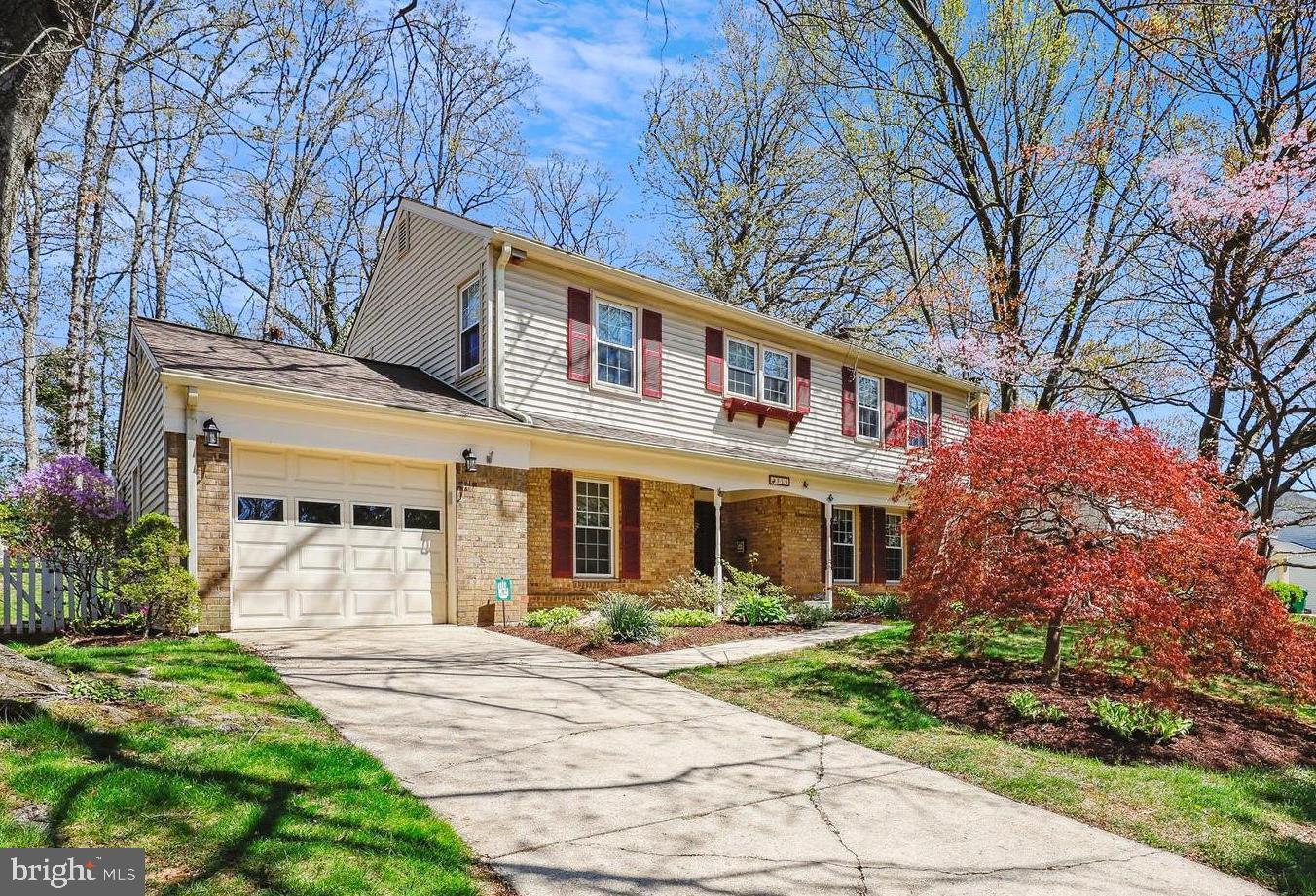 315 Summit Hall Road Gaithersburg, MD 20877 - Photo 1 of 76 a front view of a house with garden