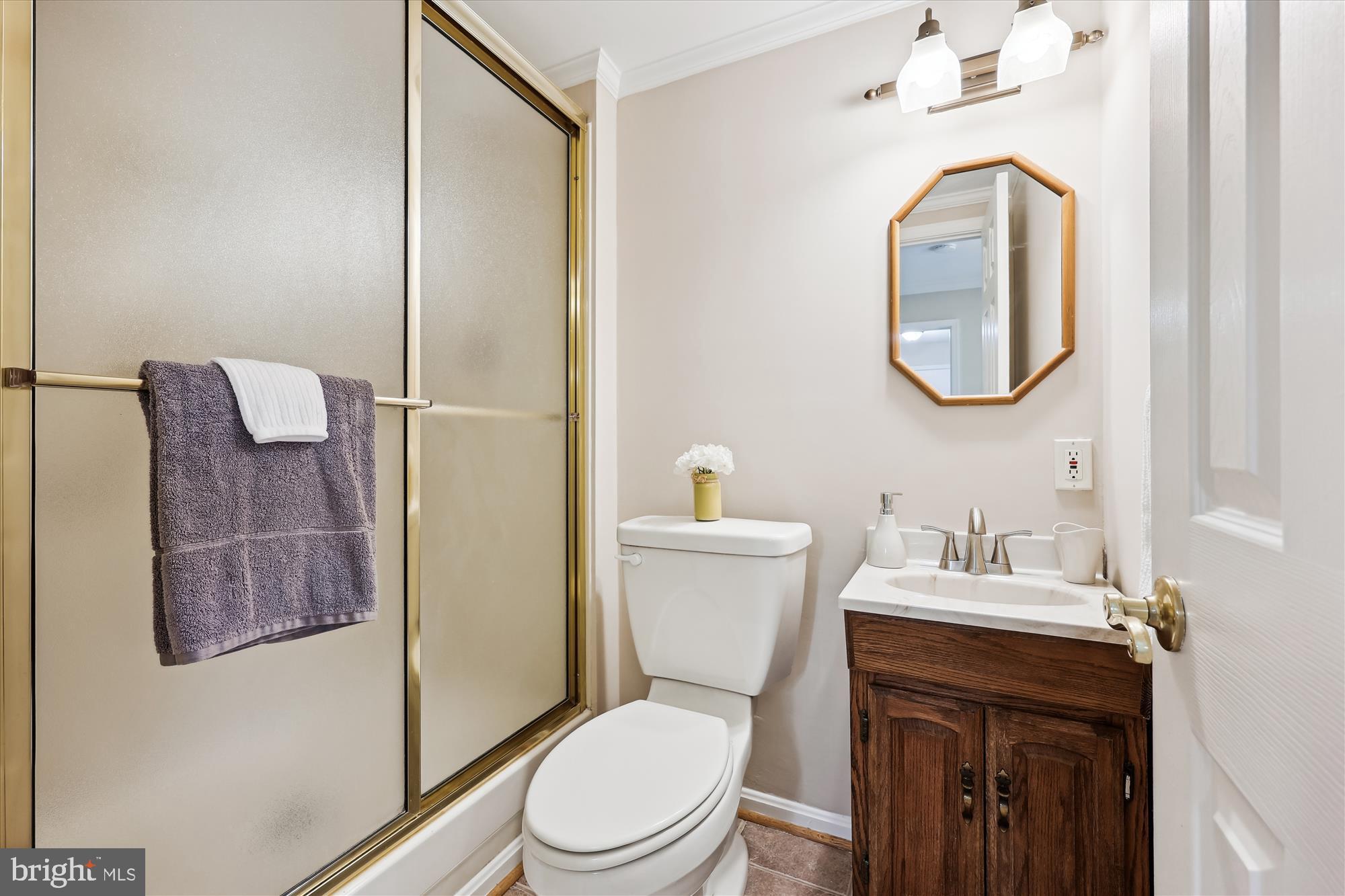 315 Summit Hall Road Gaithersburg, MD 20877 - Photo 14 of 76 a bathroom with a toilet a sink and mirror