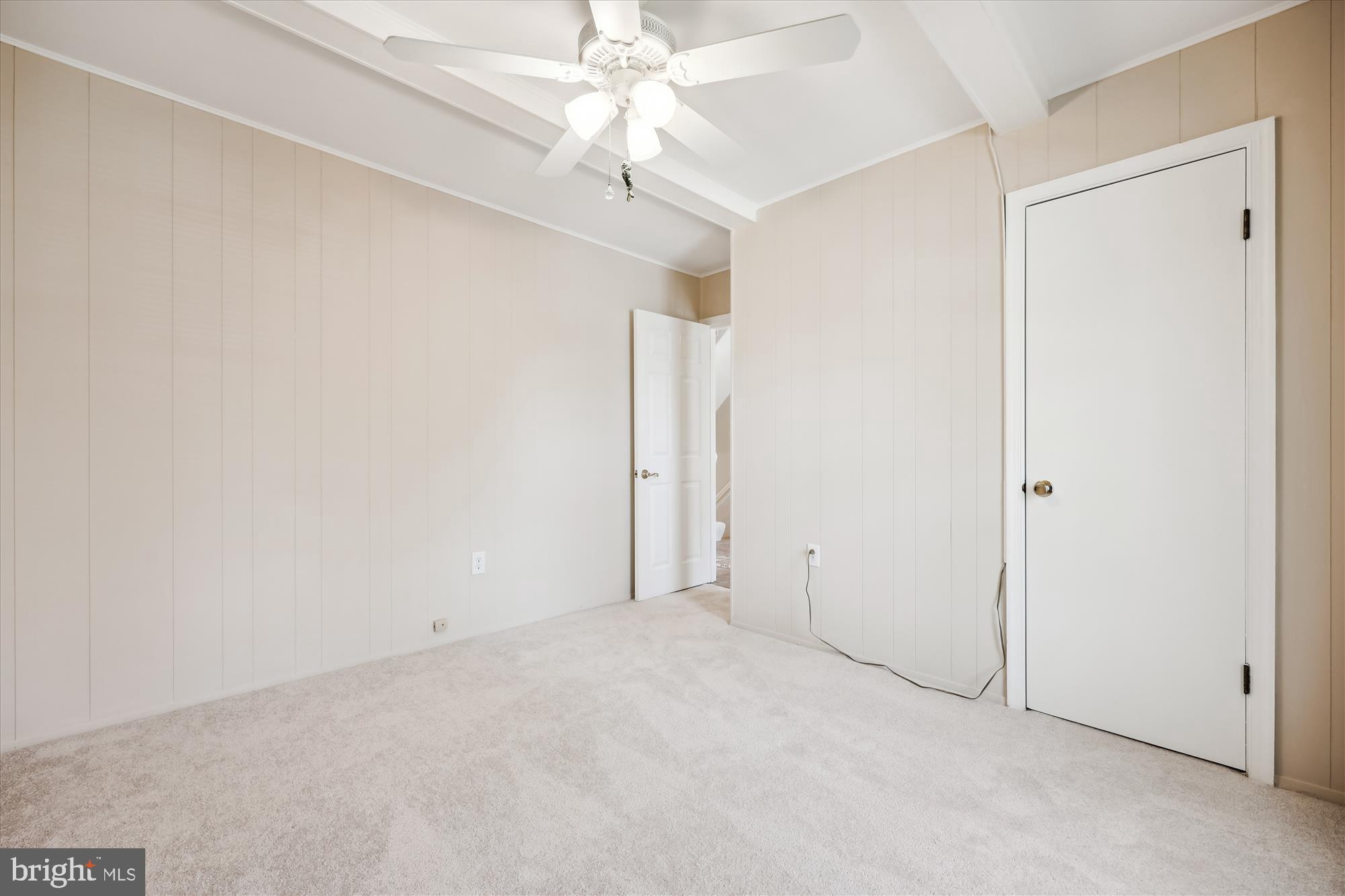 315 Summit Hall Road Gaithersburg, MD 20877 - Photo 18 of 76 an empty room with a chandelier fan and closet area
