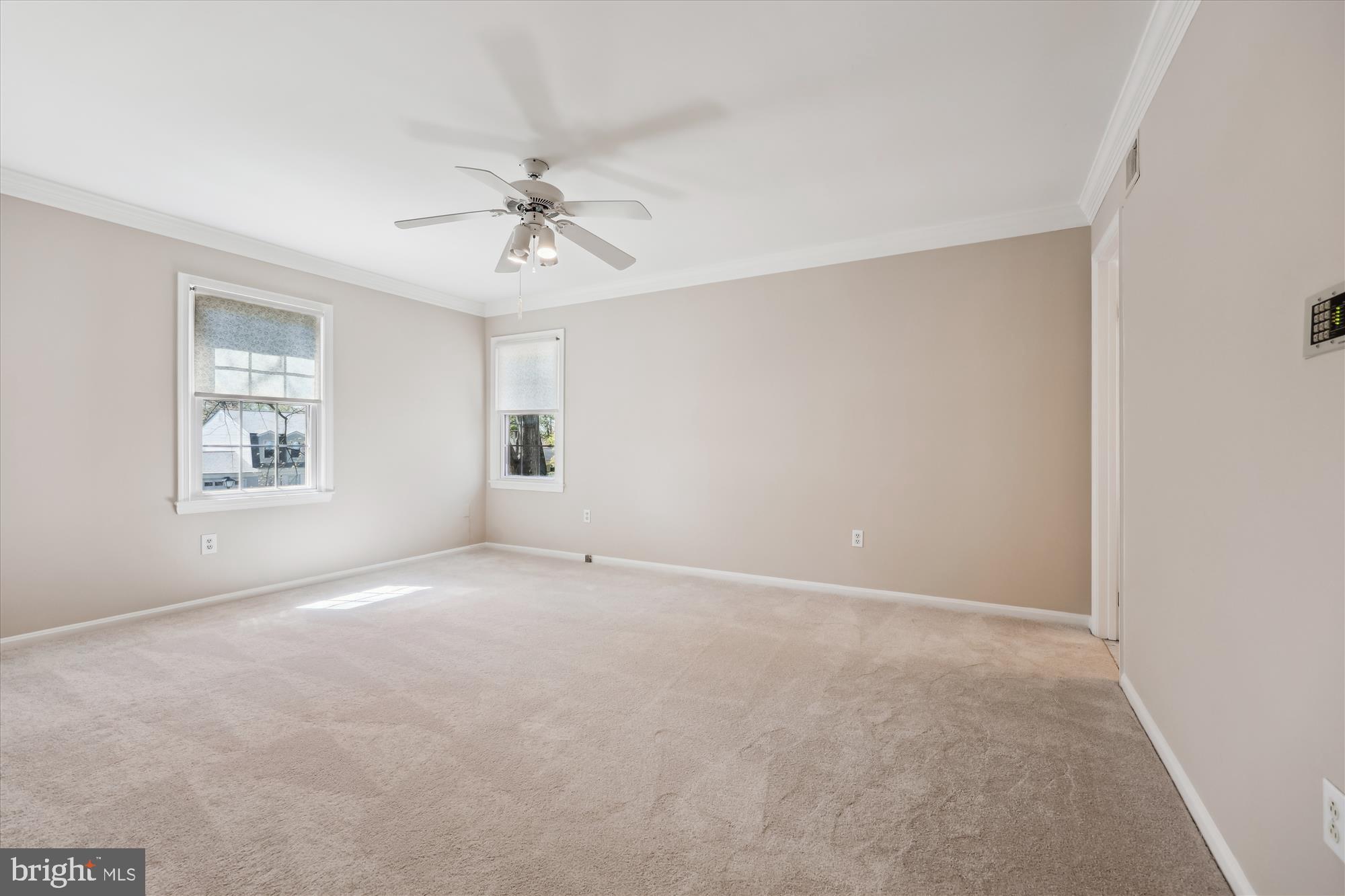 315 Summit Hall Road Gaithersburg, MD 20877 - Photo 40 of 76 an empty room with windows and ceiling fan
