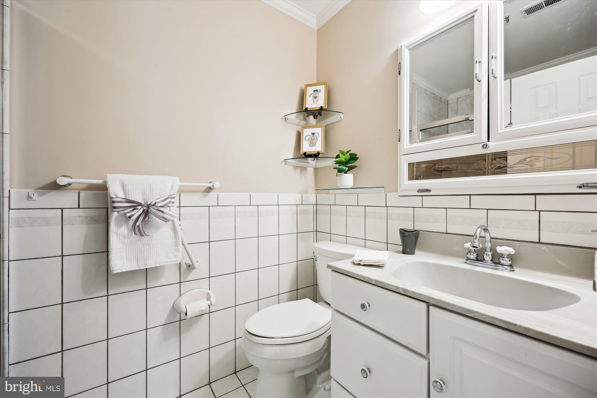 315 Summit Hall Road Gaithersburg, MD 20877 - Photo 50 of 76 a bathroom with a sink toilet and shower