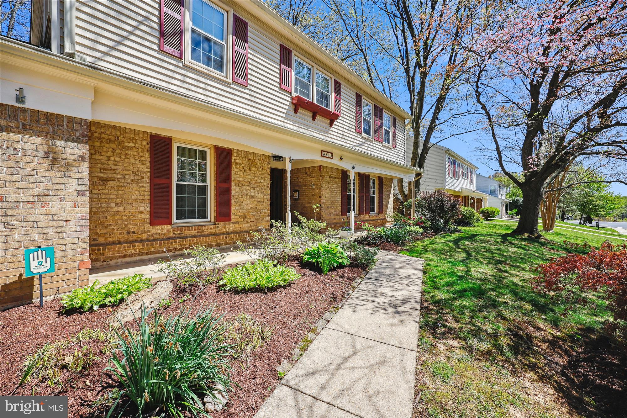 315 Summit Hall Road Gaithersburg, MD 20877 - Photo 5 of 76 a front view of a house with garden