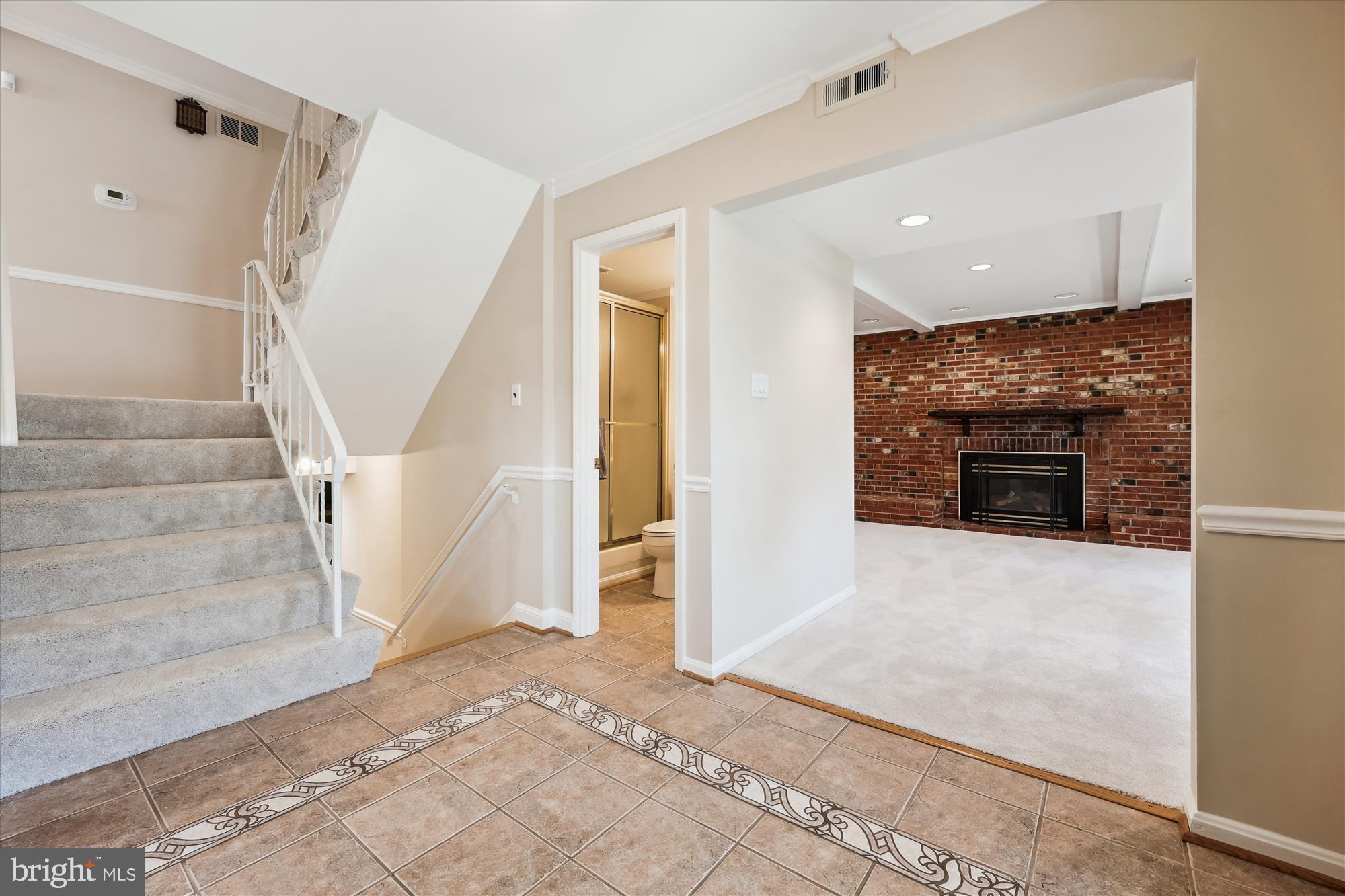315 Summit Hall Road Gaithersburg, MD 20877 - Photo 9 of 76 a view of a livingroom with an empty space and a fireplace