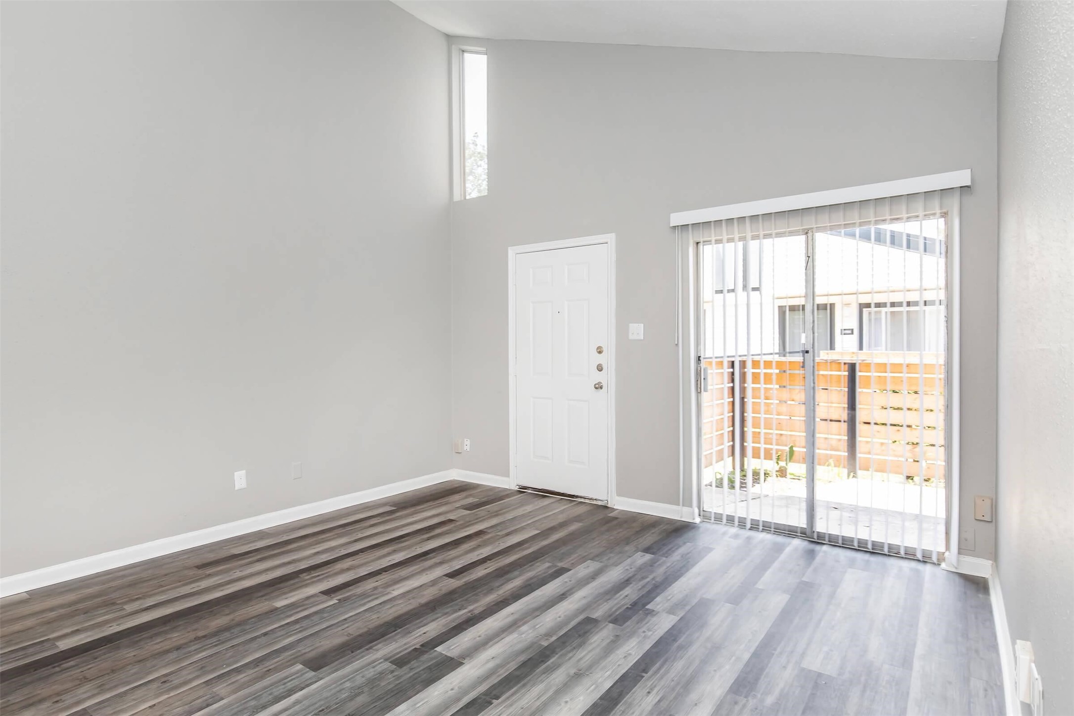 18001 Cypress Trace Road, Unit 404 Houston, TX 77090 - Photo 4 of 34 a view of a room with wooden floor and windows