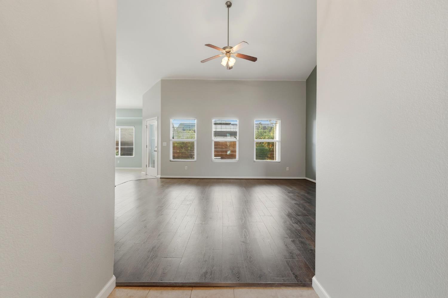 1206 North Kaplan Place Hanford, CA 93230 - Photo 13 of 52 a view of a livingroom with wooden floor and a large window