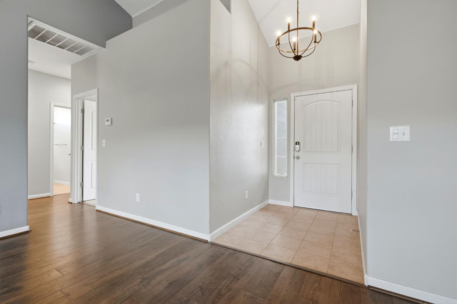 1206 North Kaplan Place Hanford, CA 93230 - Photo 14 of 52 an empty room with wooden floor