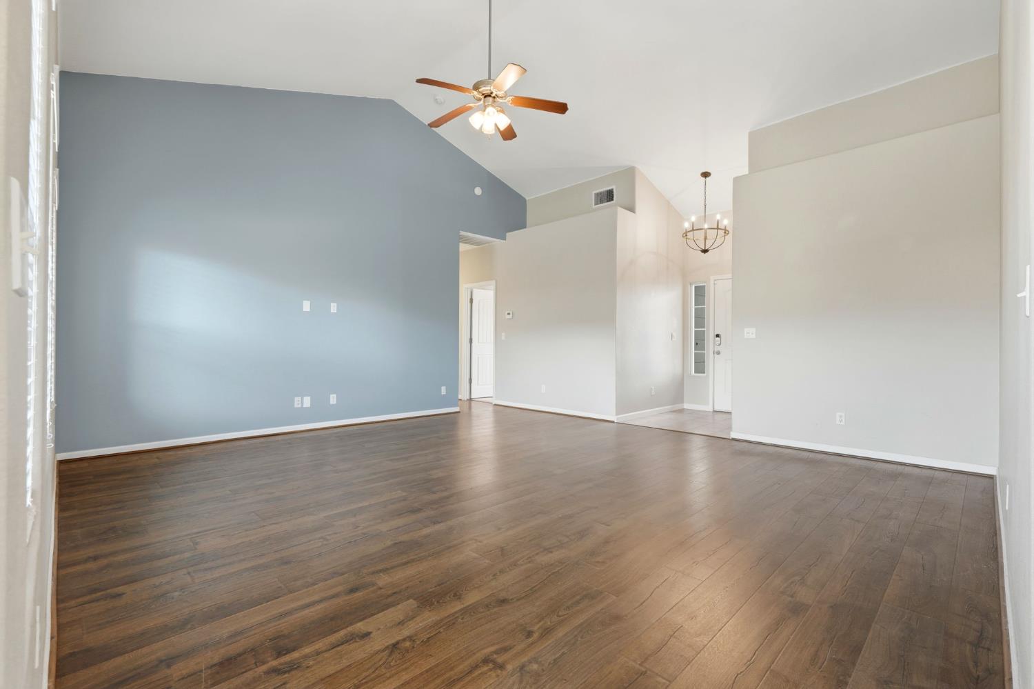 1206 North Kaplan Place Hanford, CA 93230 - Photo 18 of 52 wooden floor in an empty room with a window
