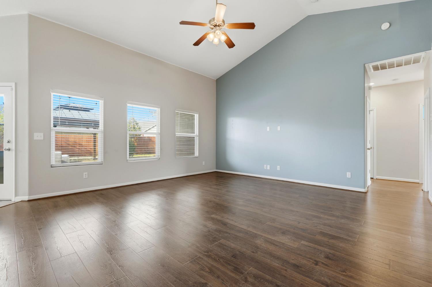 1206 North Kaplan Place Hanford, CA 93230 - Photo 19 of 52 wooden floor in an empty room with a window