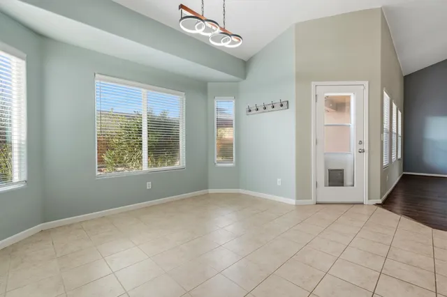 a large kitchen with stainless steel appliances kitchen island a large counter top