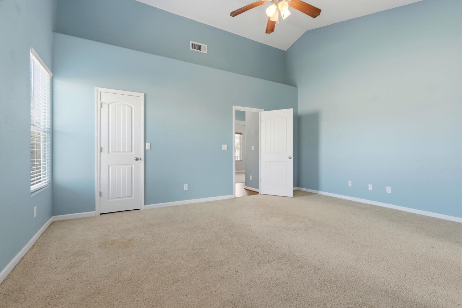 1206 North Kaplan Place Hanford, CA 93230 - Photo 39 of 52 a view of an empty room and chandelier fan