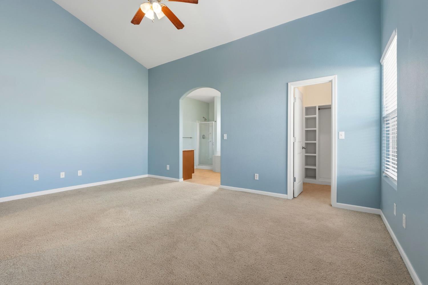 1206 North Kaplan Place Hanford, CA 93230 - Photo 40 of 52 an empty room with closet and windows