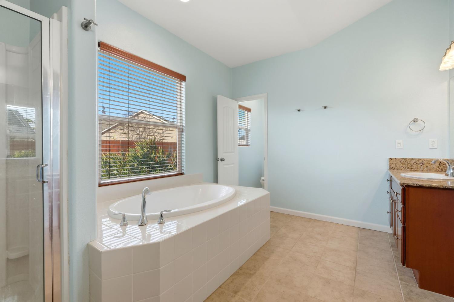 1206 North Kaplan Place Hanford, CA 93230 - Photo 43 of 52 a bathroom with a tub and a sink