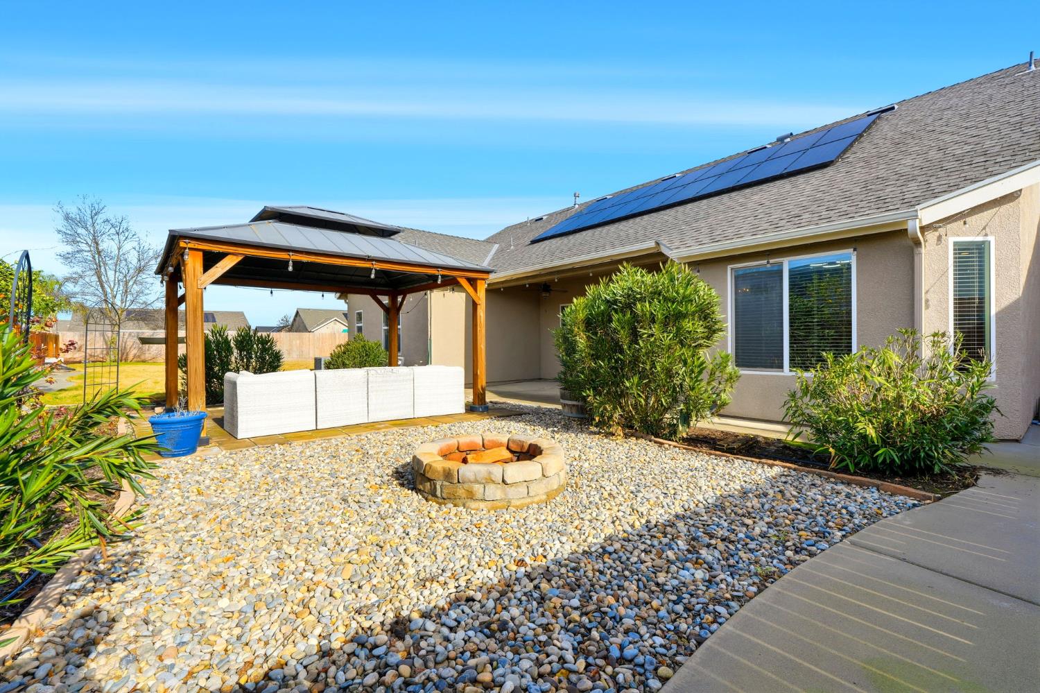 1206 North Kaplan Place Hanford, CA 93230 - Photo 46 of 52 a front view of a house with garden