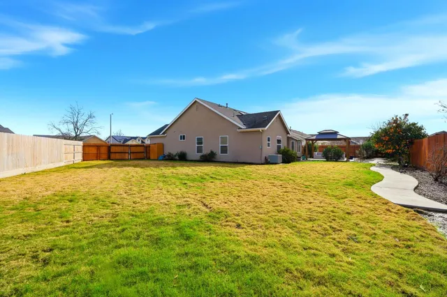 an aerial view of a house with a swimming pool