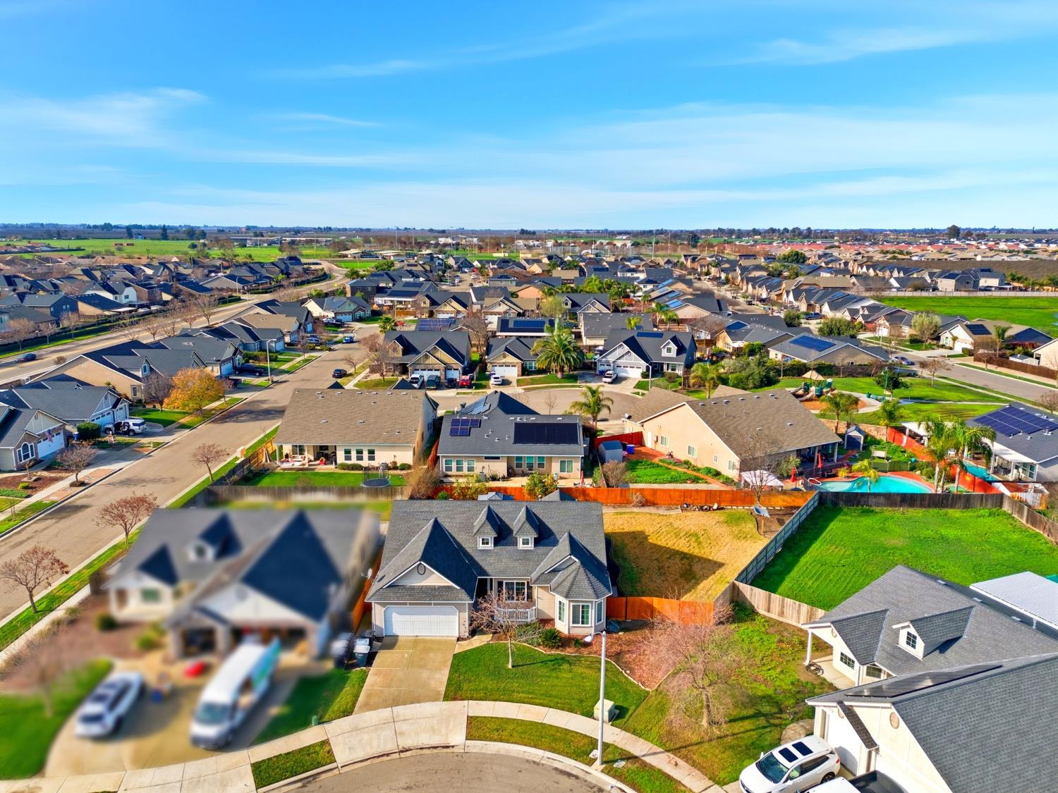 1206 North Kaplan Place Hanford, CA 93230 - Photo 10 of 52 an aerial view of a houses with a swimming pool