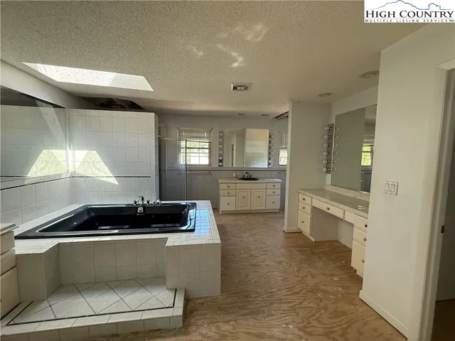 a kitchen with a sink and stove