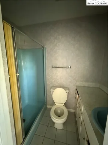 a bathroom with a toilet and a sink