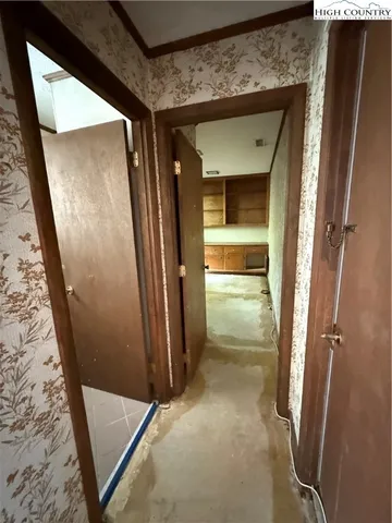 a view of empty room with windows