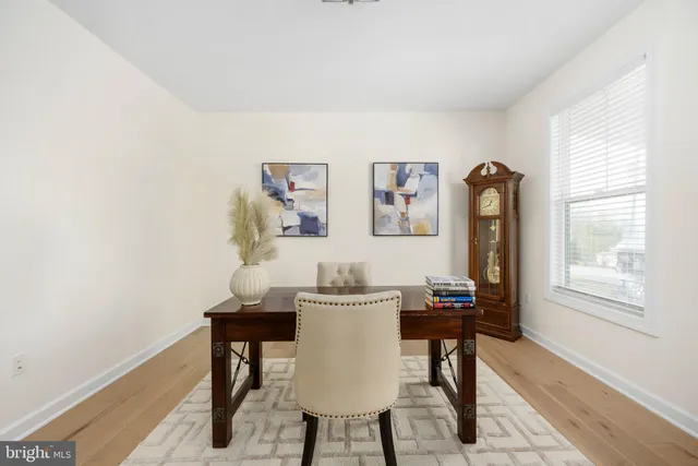 a living room with furniture fireplace and window