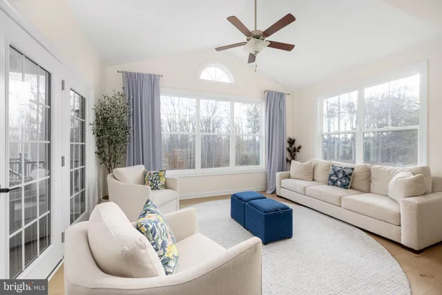 a large bathroom with a double vanity sink a mirror and a bathtub