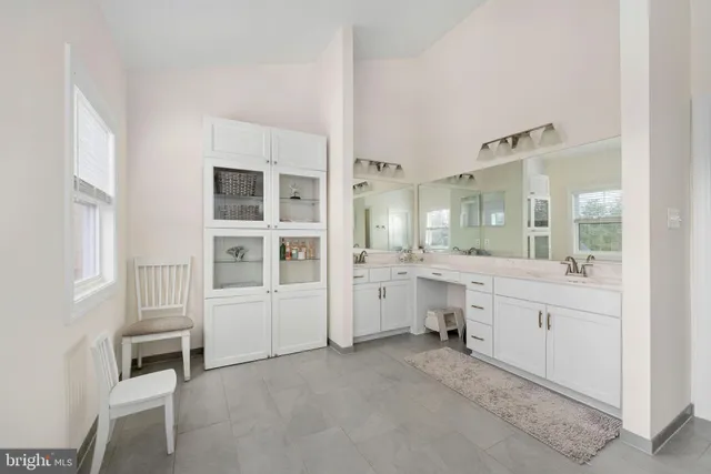 a bedroom with a bed and a chair