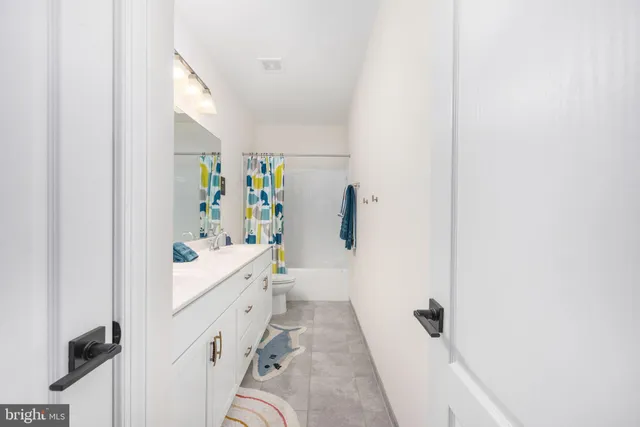 a spacious bedroom with a bed and a couch