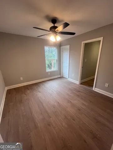 a view of room with wooden floor