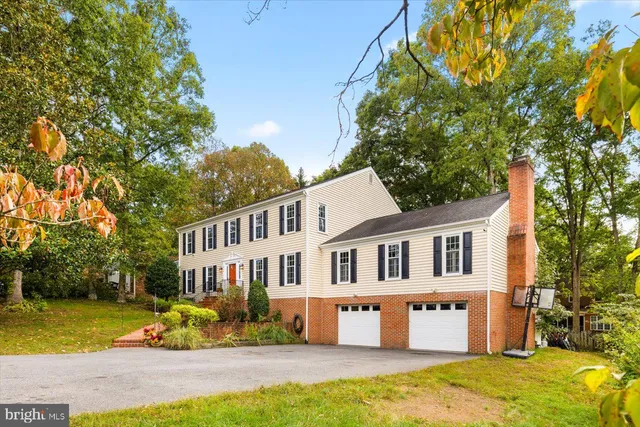 a front view of a house with a yard table and chairs