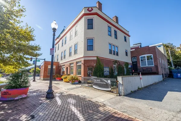 a front view of a building with street view