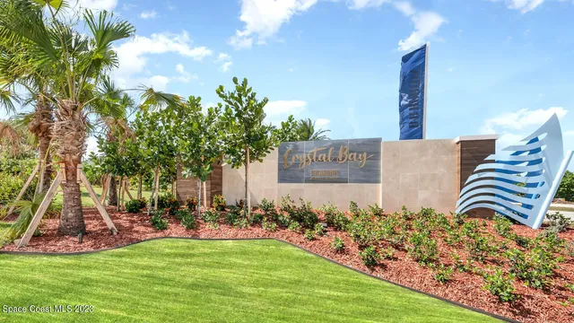 a living room with furniture a window and a potted plant