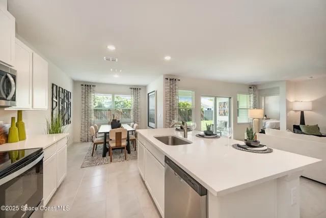 a kitchen with a table and chairs in it