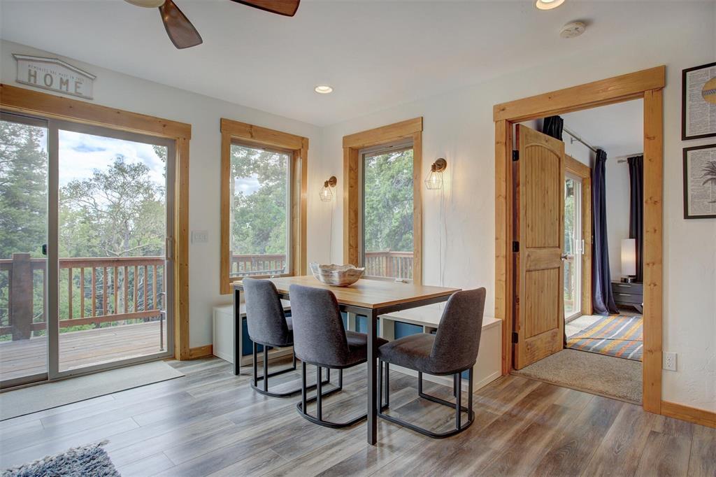 1002 Venture Road Fairplay, CO 80440 - Photo 11 of 35 a view of a dining room with furniture window and wooden floor