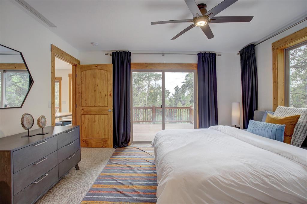 1002 Venture Road Fairplay, CO 80440 - Photo 12 of 35 a bedroom with a large bed and a window