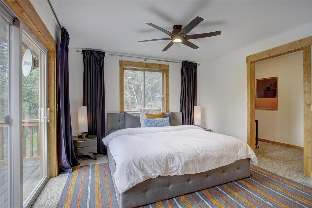1002 Venture Road Fairplay, CO 80440 - Photo 14 of 35 a bedroom with a large bed and a large window