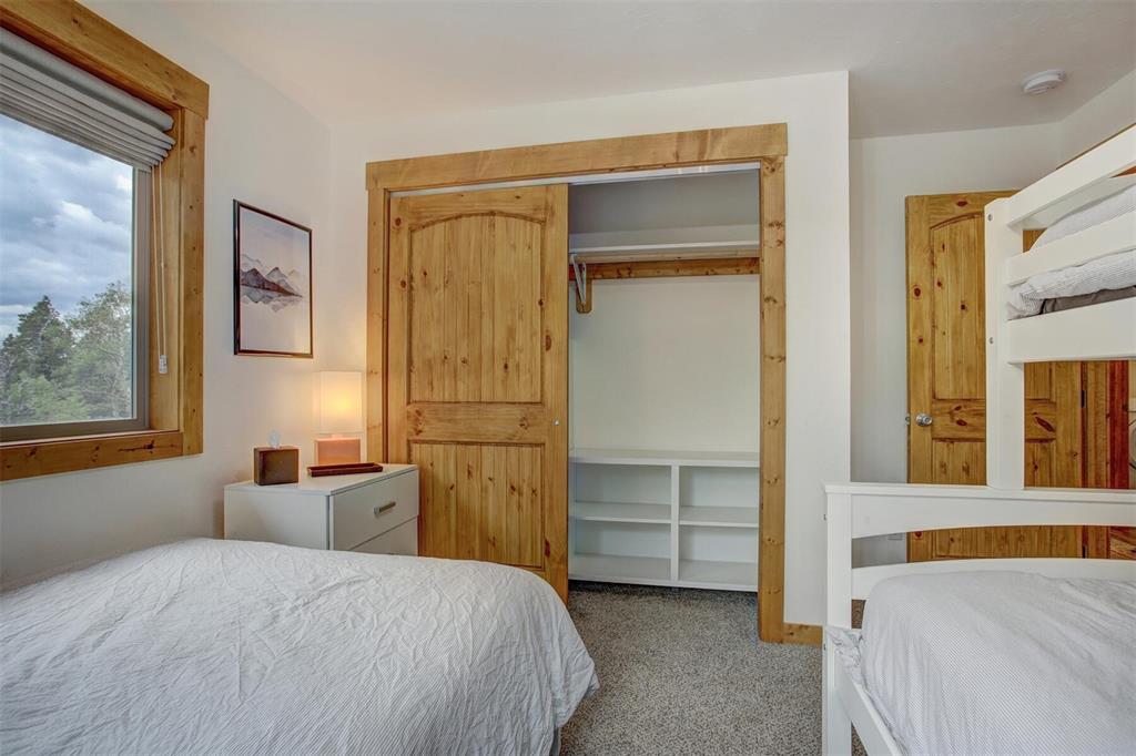 1002 Venture Road Fairplay, CO 80440 - Photo 19 of 35 a bedroom with a bed and a window