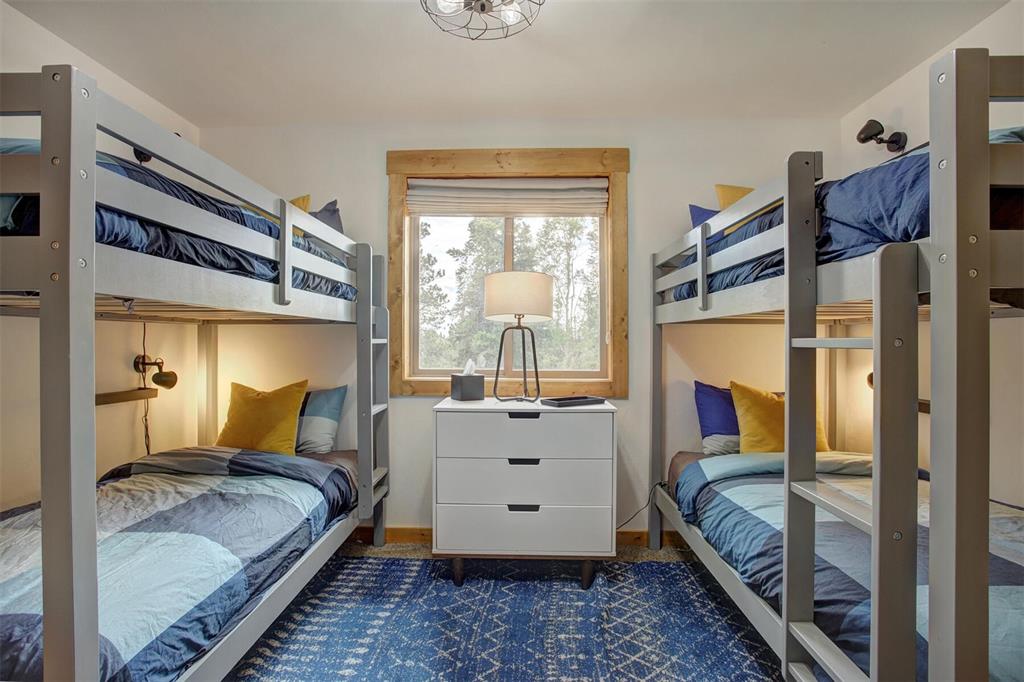 1002 Venture Road Fairplay, CO 80440 - Photo 21 of 35 a bed room with a bed and a large window