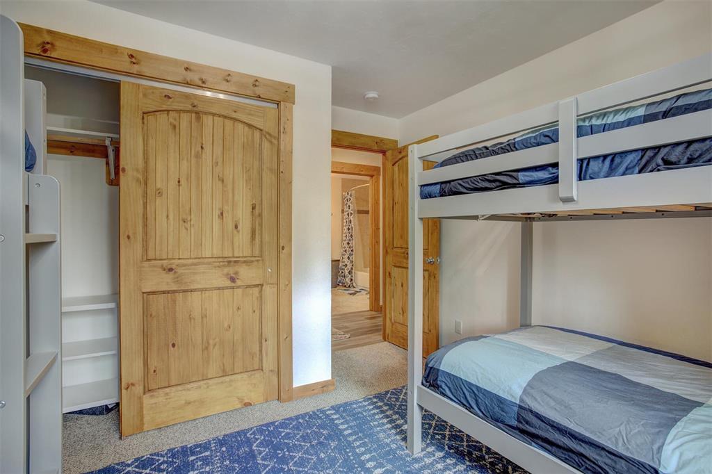 1002 Venture Road Fairplay, CO 80440 - Photo 22 of 35 a bedroom with a bed and hallway