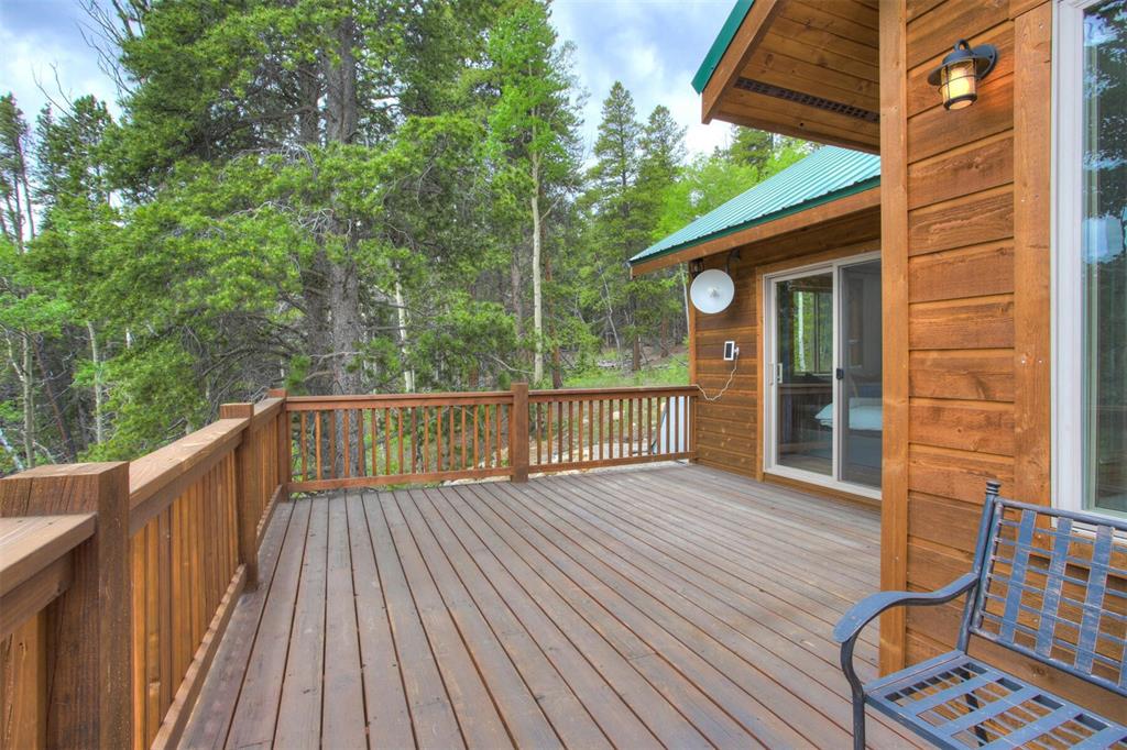 1002 Venture Road Fairplay, CO 80440 - Photo 26 of 35 a view of a wooden deck with a yard