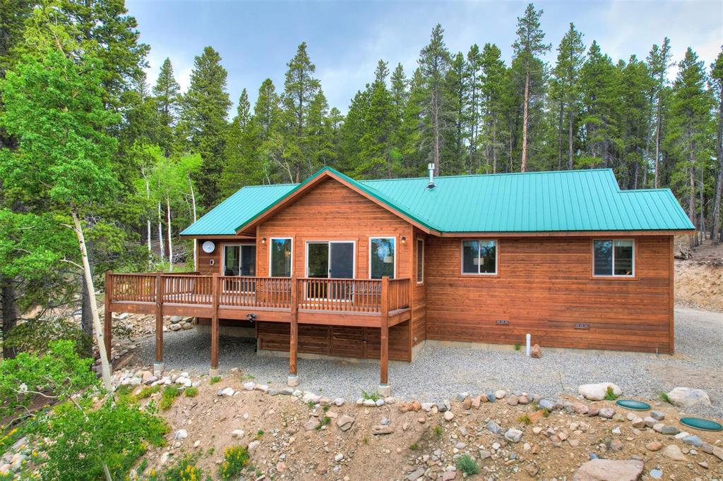 1002 Venture Road Fairplay, CO 80440 - Photo 3 of 35 a front view of a house with garden