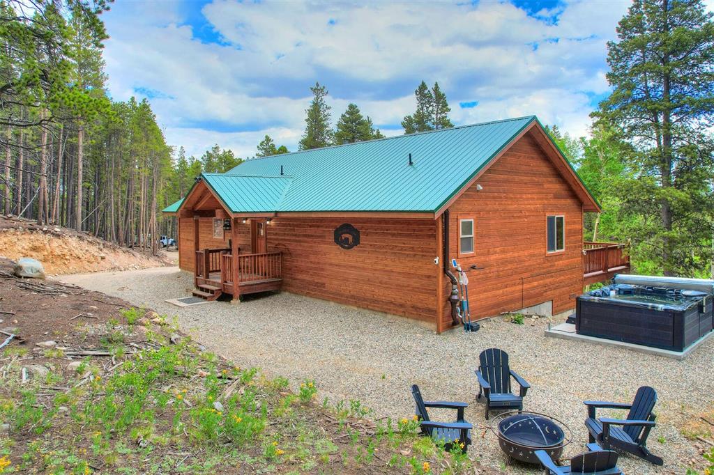 1002 Venture Road Fairplay, CO 80440 - Photo 4 of 35 a front view of a house with garden