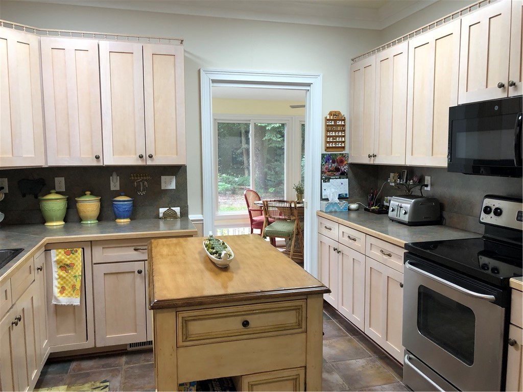 103 Pruitt Street Pendleton, SC 29670 - Photo 5 of 29 Kitchen with plenty of cabinets and adjoining sunr