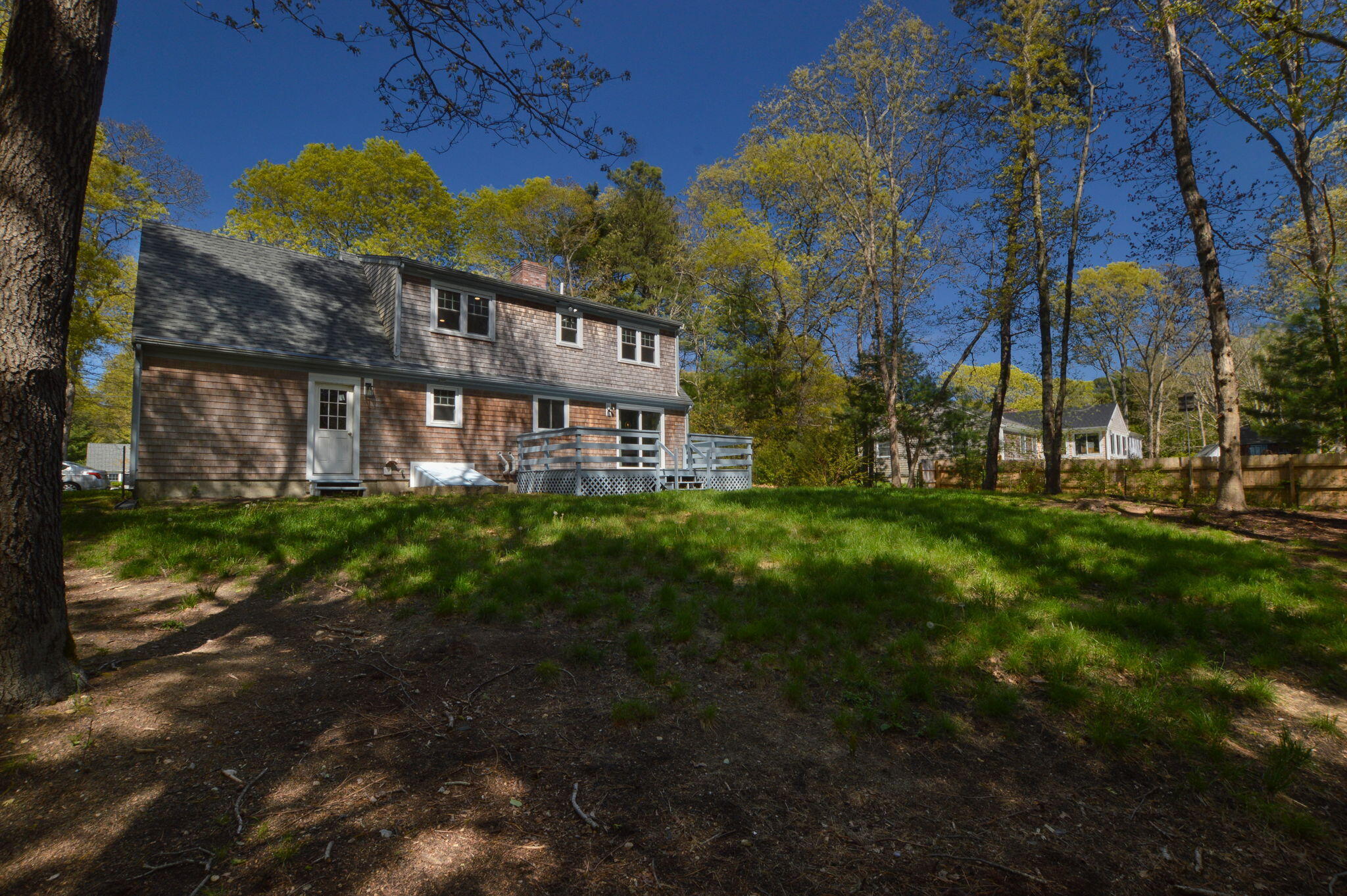 645 Lumbert Mill Road Centerville, MA 02632 - Photo 25 of 30 a view of a house with a garden