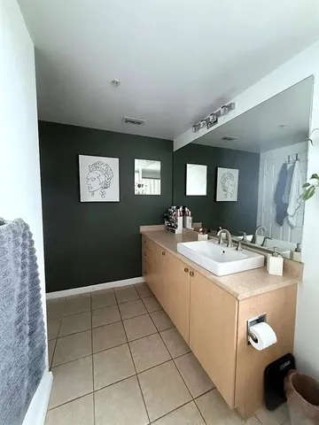 a view of a bathroom with sink and mirror