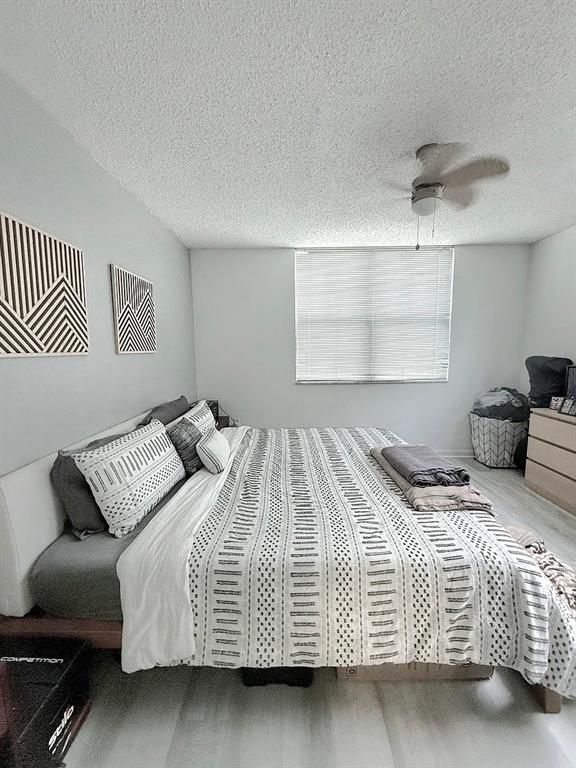 1919 Van Buren Street, Unit 609 Hollywood, FL 33020 - Photo 5 of 15 a bedroom with a bed and window
