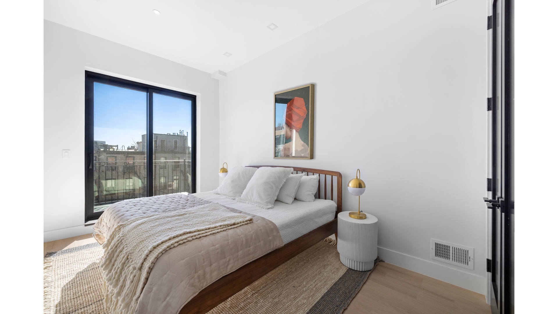 112 Luquer Street, Unit 2 Brooklyn, NY 11231 - Photo 5 of 11 a large bed sitting in a bedroom next to a window