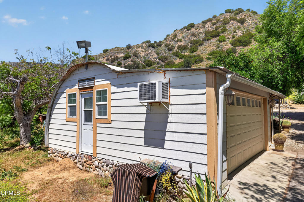 8416 Wheeler Canyon Road Santa Paula, CA 93060 - Photo 26 of 48 a view of a house with a garage