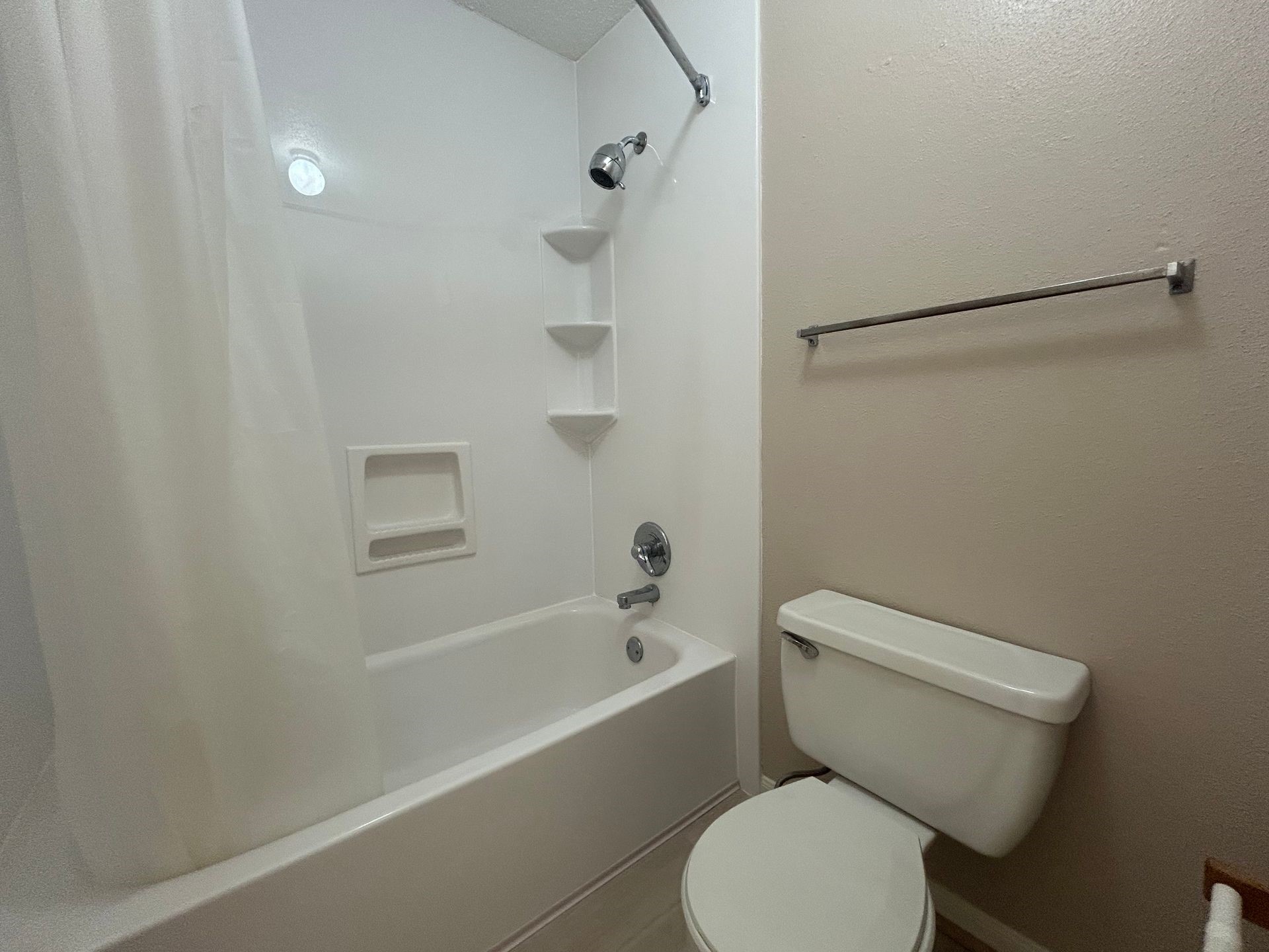 12550 Whittington Drive, Unit 610 Houston, TX 77077 - Photo 9 of 10 a white toilet sitting next to a bath tub
