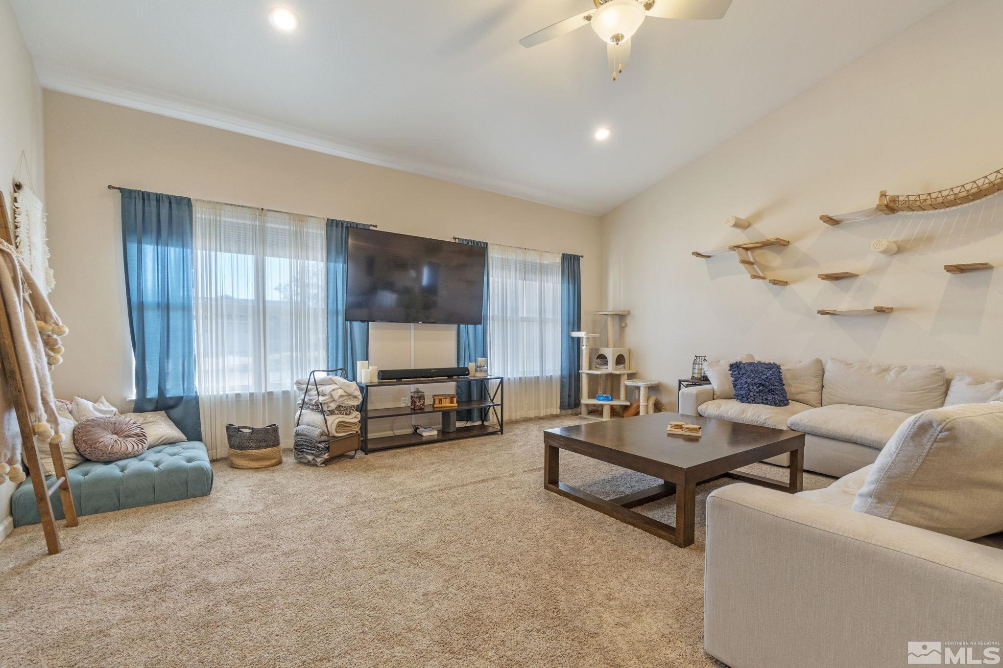 1837 Sky Ridge Drive Fallon, NV 89406 - Photo 6 of 34 a living room with furniture and a flat screen tv