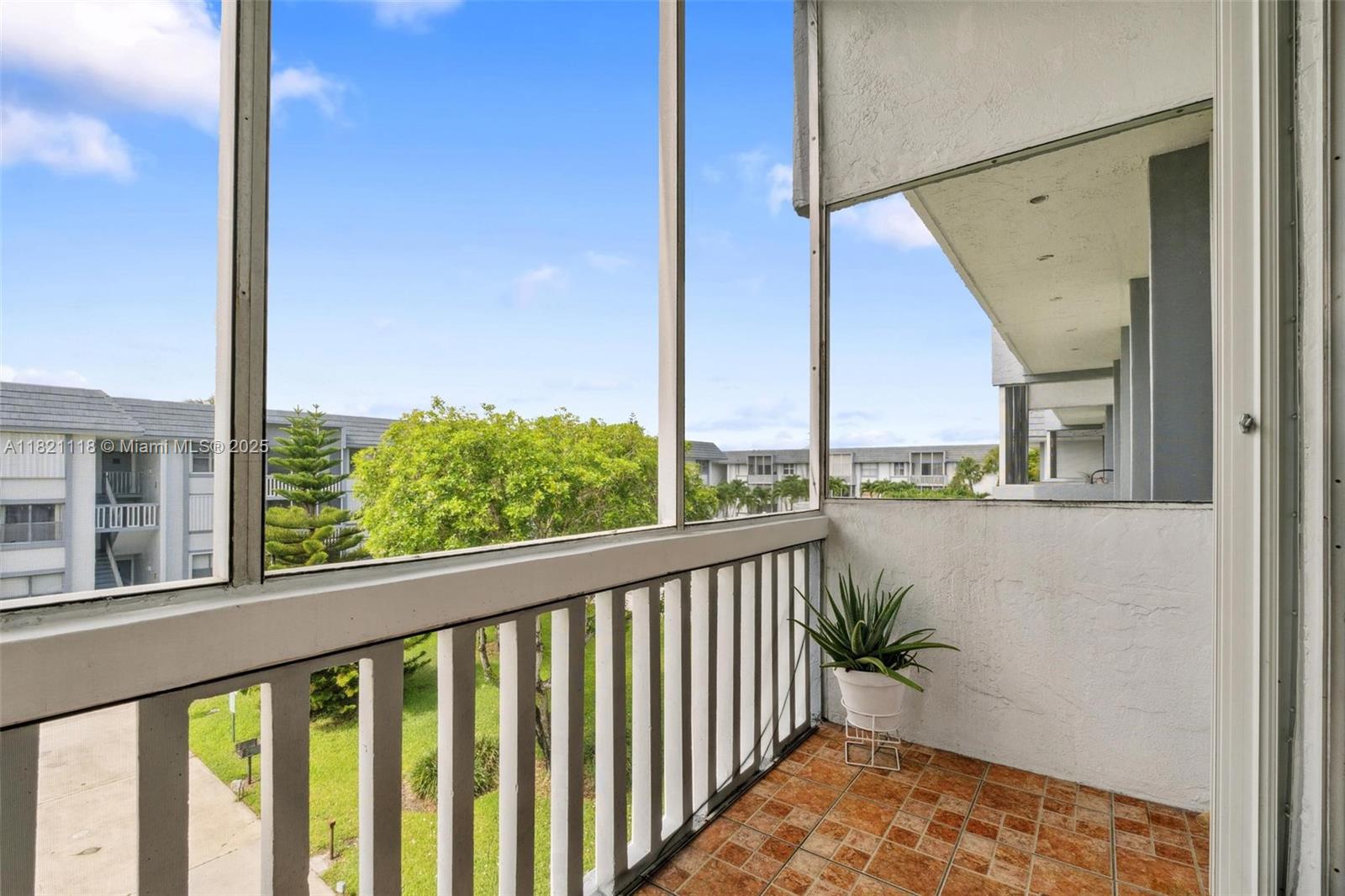 6705 Northwest 169th Street, Unit C310 Hialeah, FL 33015 - Photo 23 of 26 a view of balcony